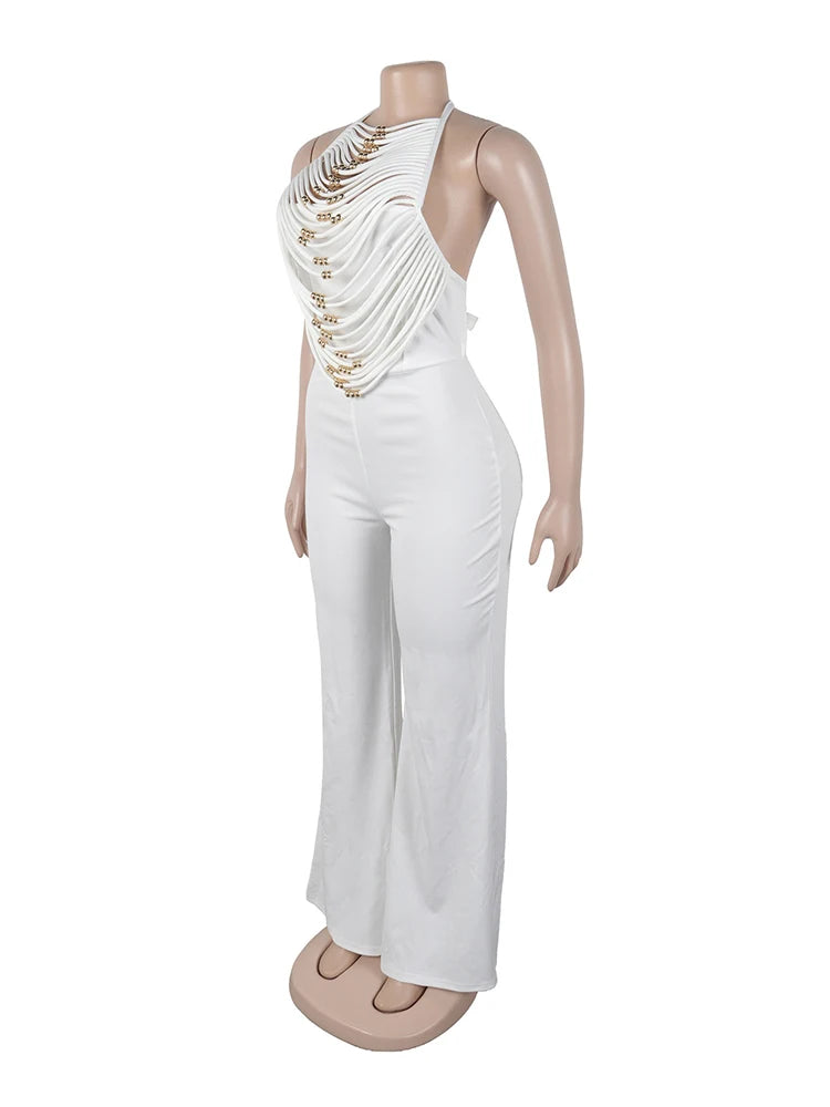 White jumpsuit with gold embellishments on a mannequin against a white background