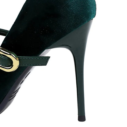 Green high-heeled shoe with a gold buckle on a white background