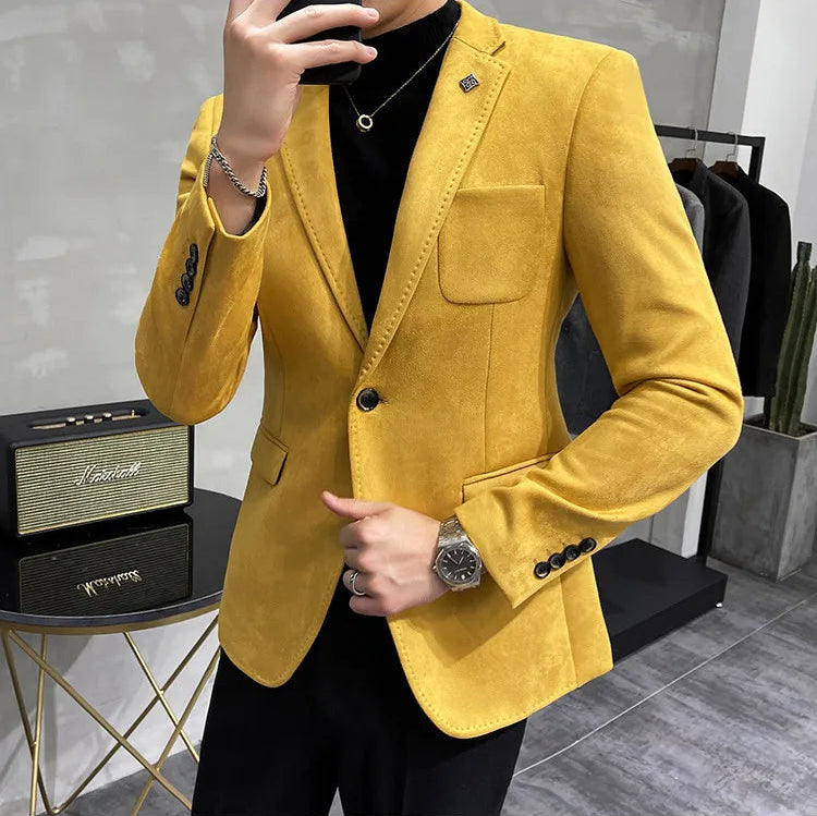 Person wearing a yellow blazer in an indoor setting
