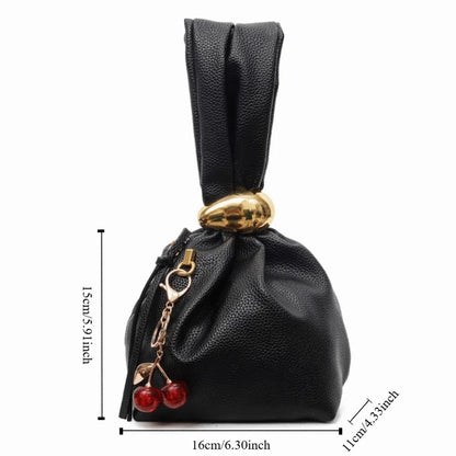 Black drawstring bag with gold accents and cherry decorations, shown with measurements on a white background.