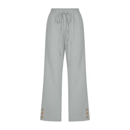 Light gray pants with button details on a white background
