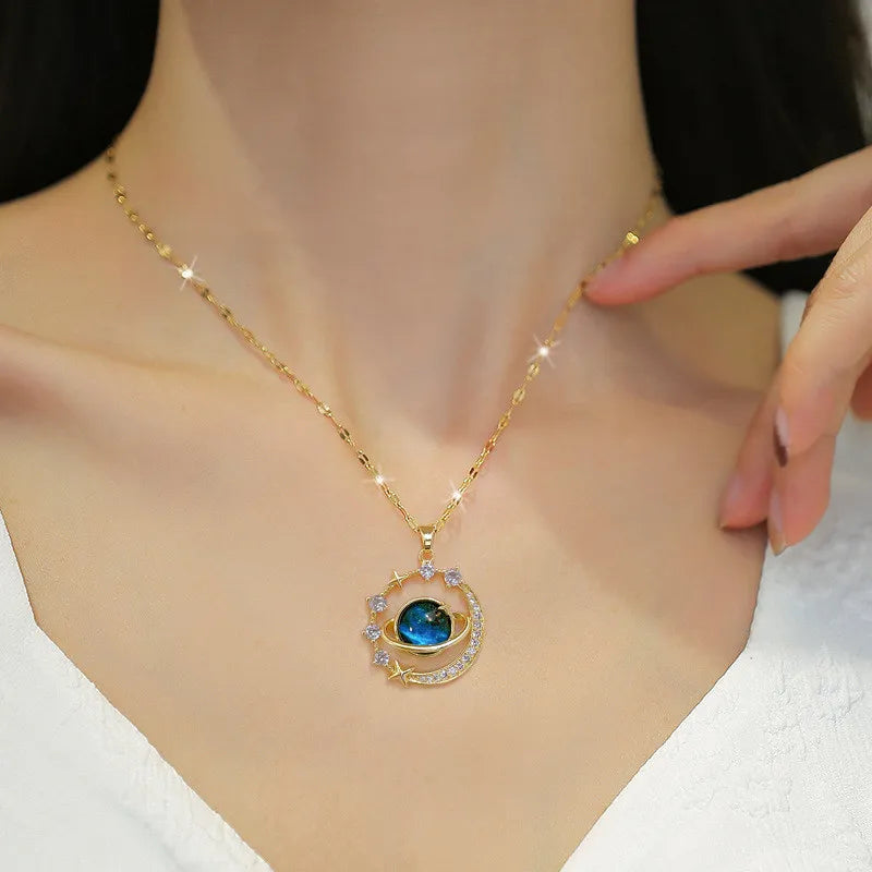 Gold necklace with a blue gemstone pendant
