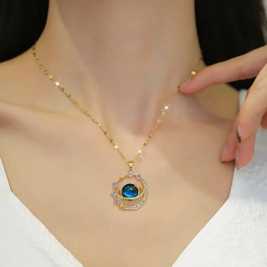Gold necklace with a blue gemstone pendant