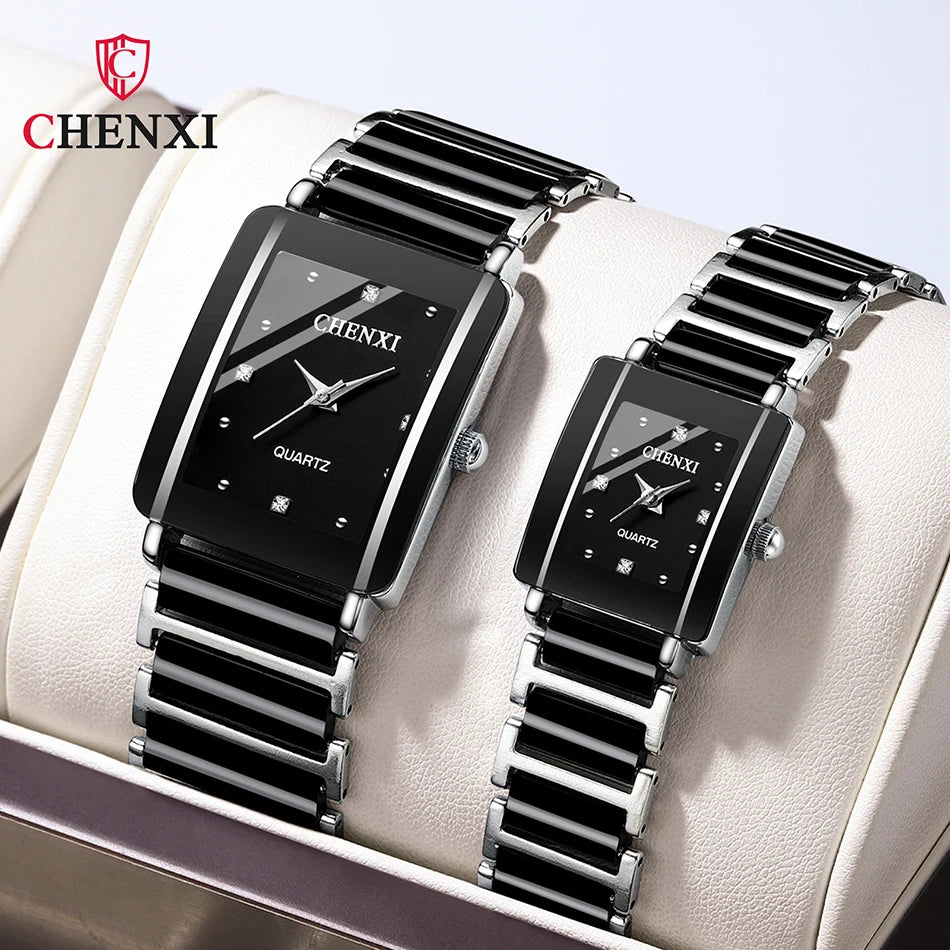 Two black and silver watches with 'CHENXI' branding on a white cushion.