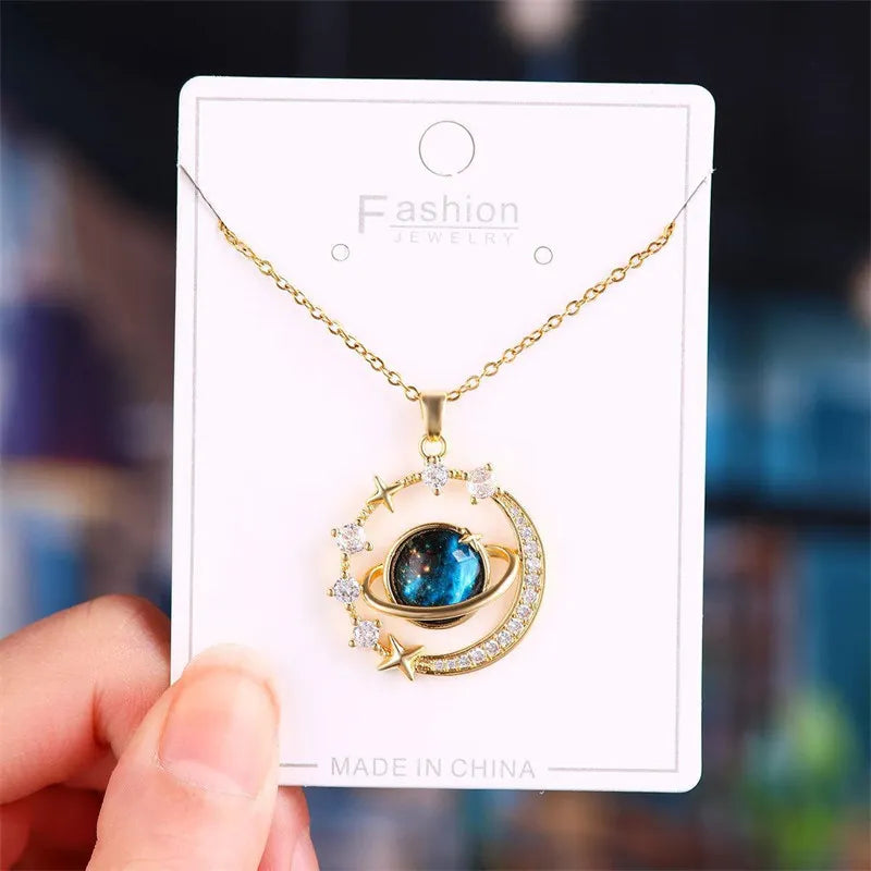 Gold necklace with a blue pendant on VIP white card
