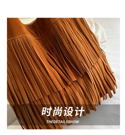 Brown suede fringe bag with 'THEDETAILSSHOW' branding on a light background