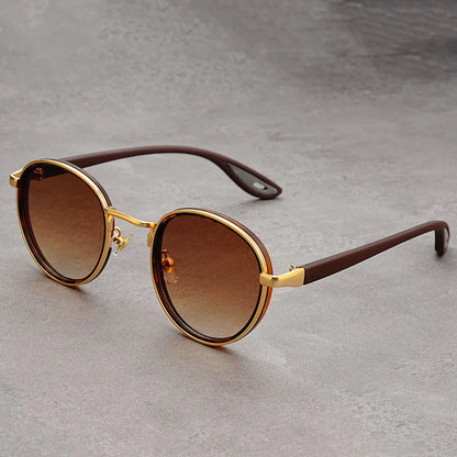 Retro round sunglasses featuring gold-tone frames and brown gradient lenses