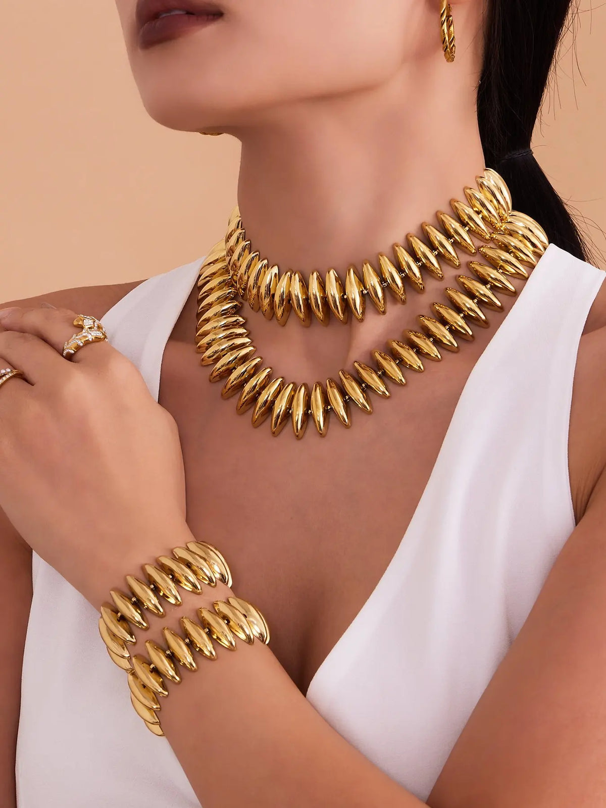 Sculptural Gold Beaded Jewelry Collection