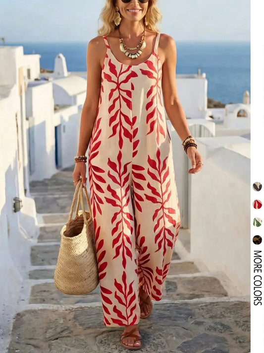 Woman wearing a red and beige patterned dress in a Mediterranean setting