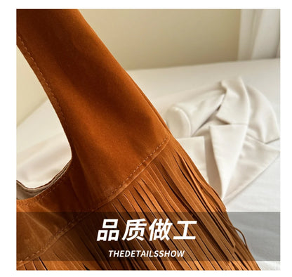 Brown suede bag with fringe details on a white background, featuring the brand 'THEDETAILSSHOW'.
