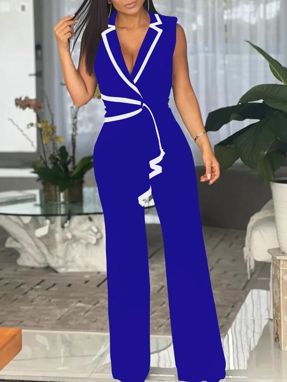Woman wearing a blue and white jumpsuit in an indoor setting.