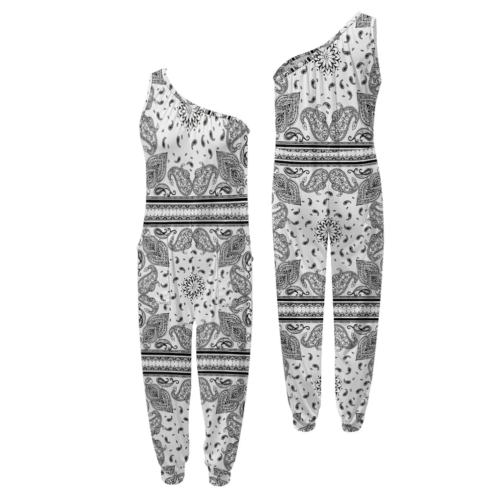 Black and white patterned one-shoulder top and pants set on a white background .