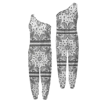 Black and white patterned one-shoulder top and pants set on a white background .