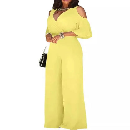 Yellow cold-shoulder dress worn by a model on a white background