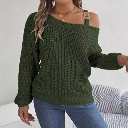 Person wearing a green knitted sweater with cut-out shoulders against a white background