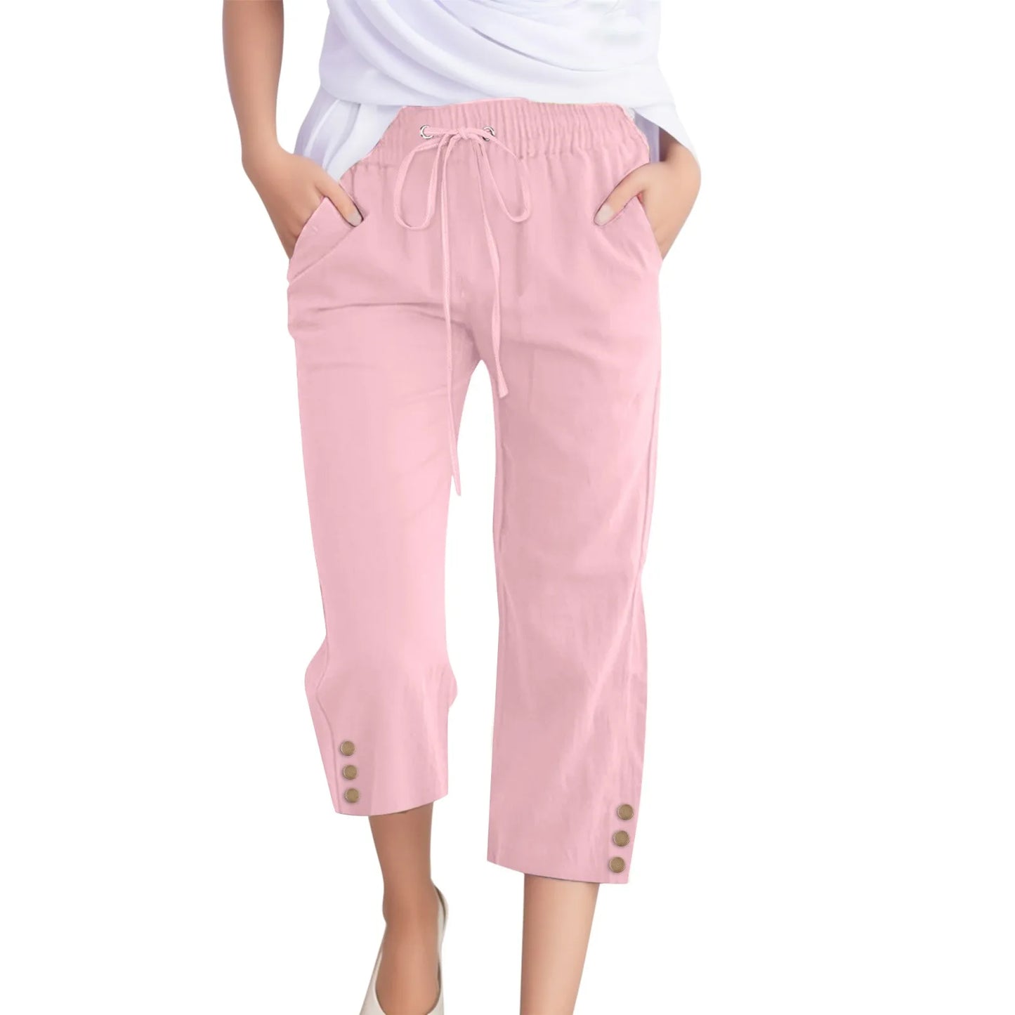 Pink capri pants with drawstring waist and button details on a white background