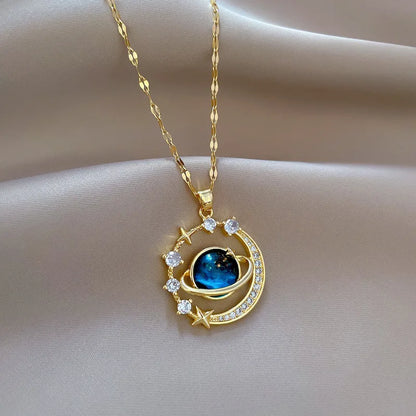 Gold necklace with a blue gemstone pendant on a beige fabric background