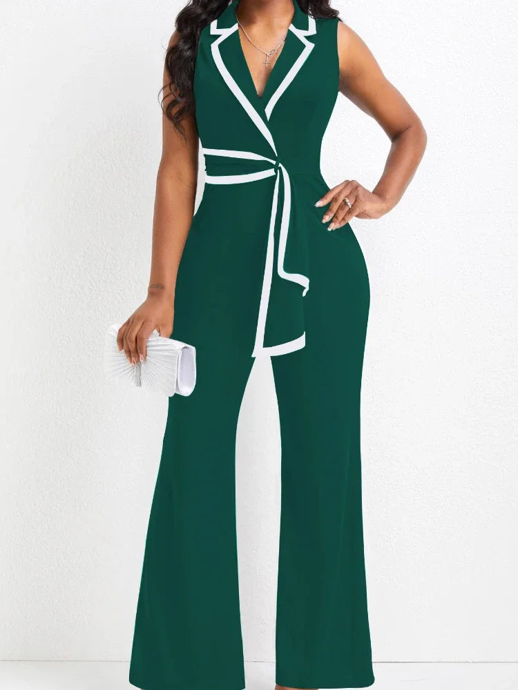 Green and white dress with a belt on a white background
