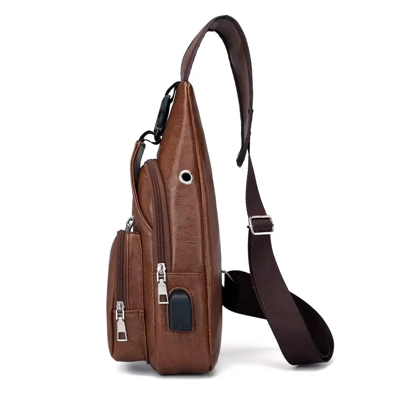 Brown leather sling bag with multiple pockets on a white background