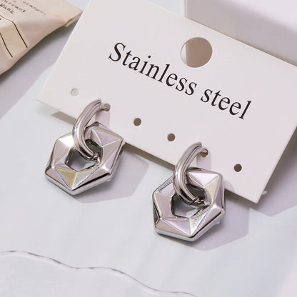 Stainless steel earrings on a white card with 'Stainless steel' text