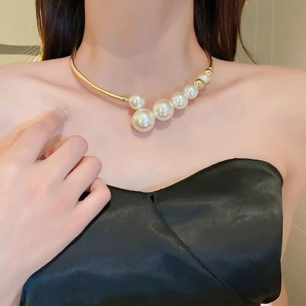 Pearl necklace being worn by a person with a blurred background