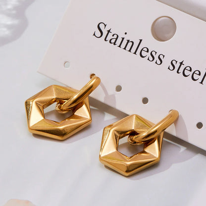 Gold geometric earrings on a white background with 'Stainless steel' label.