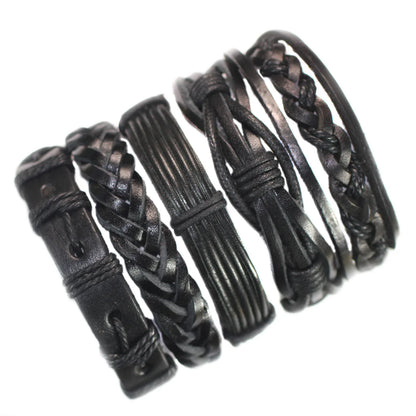 Set of black leather bracelets with braided and textured designs on a white background