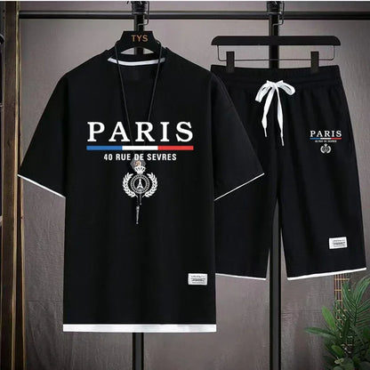 Black 'PARIS' t-shirt and shorts set on hangers with a gray background