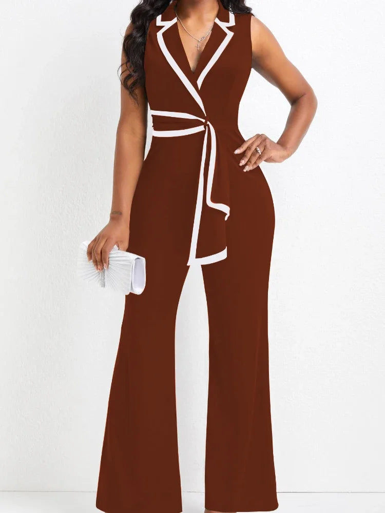 Brown jumpsuit with white accents worn by a model on a white background