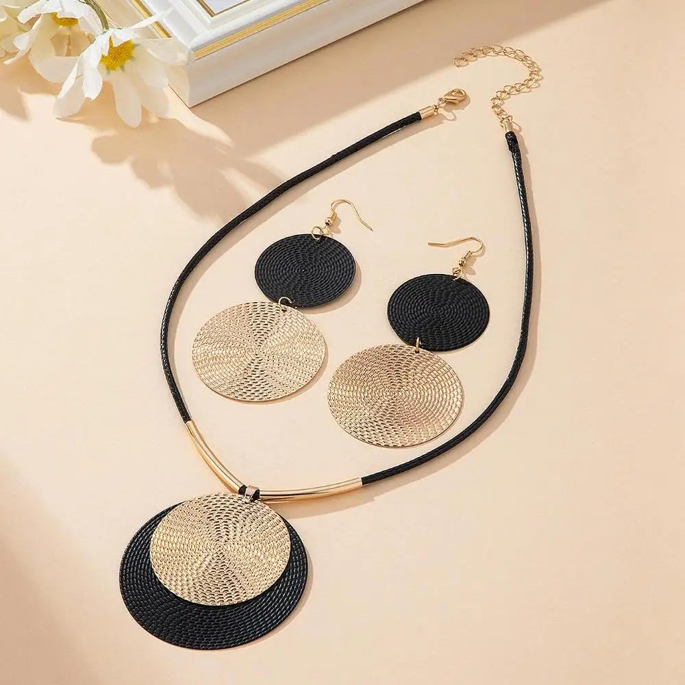 Jewelry set with necklace and earrings on a beige background