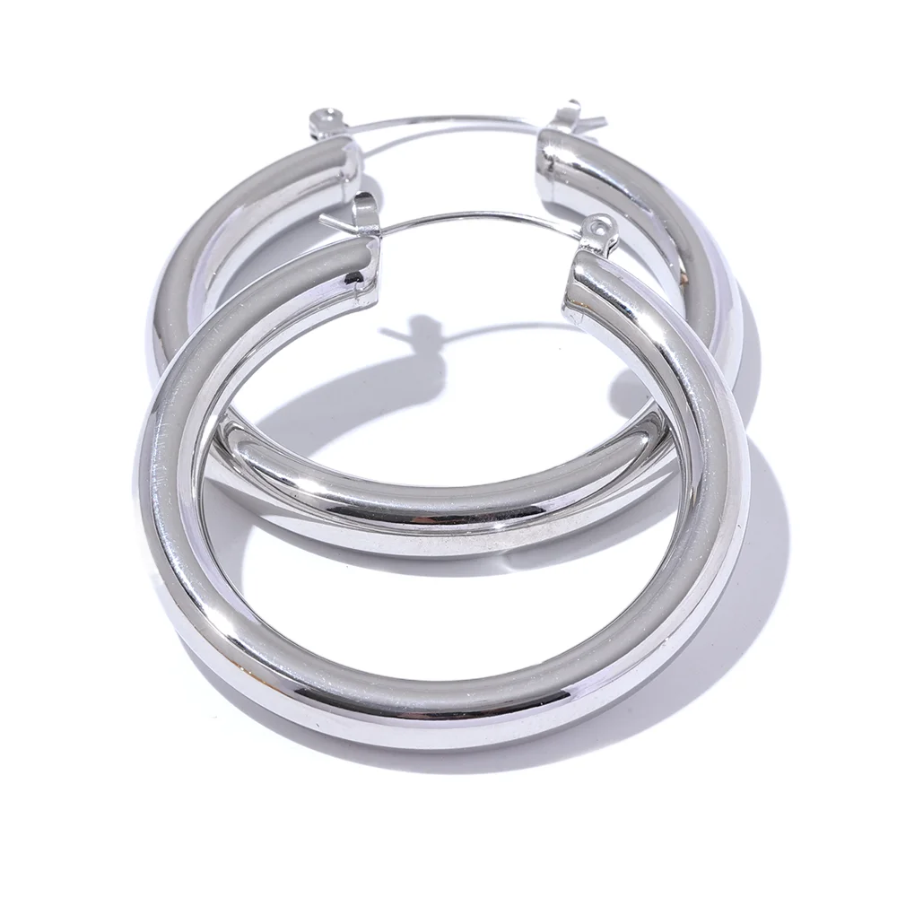 Pair of silver hoop earrings on a white background