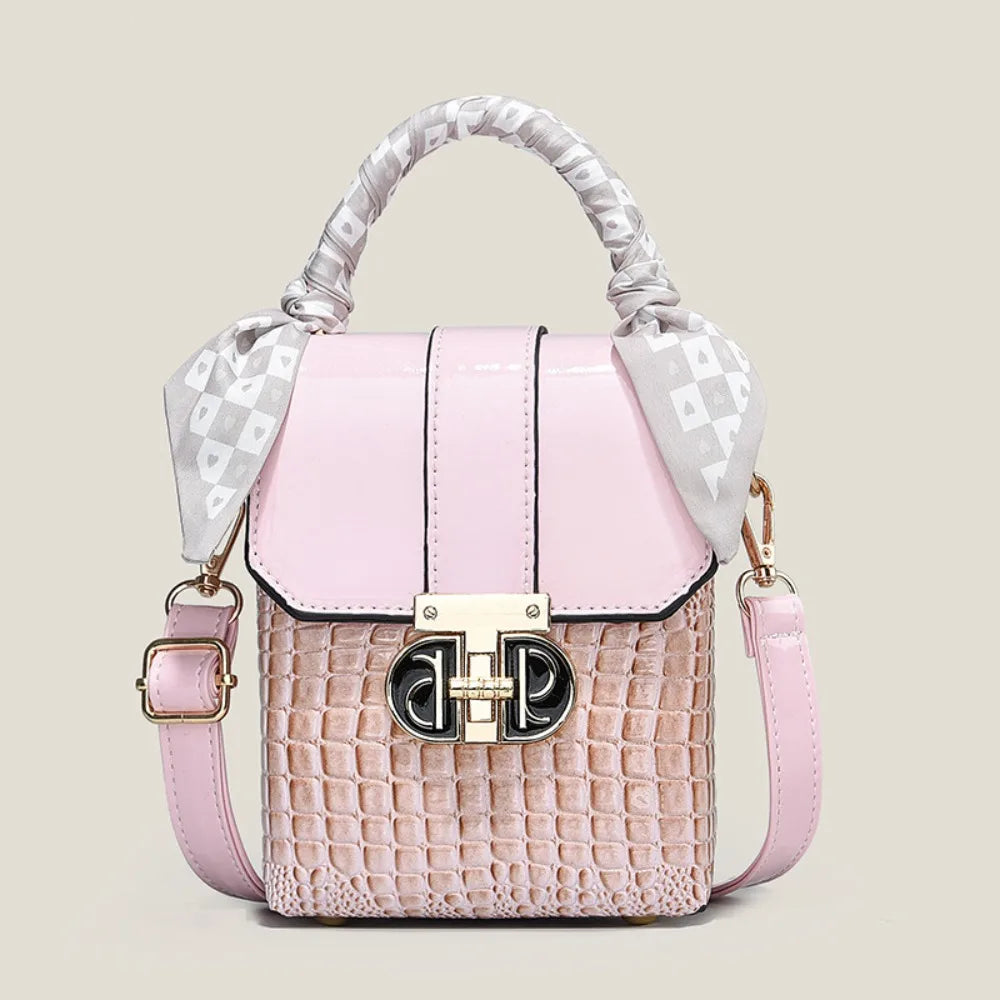 Pink handbag with a textured pattern and decorative handle on a light beige background