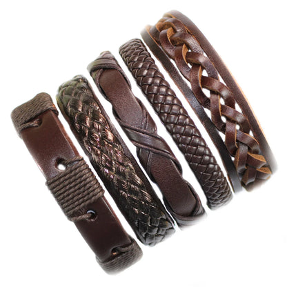 Set of braided leather bracelets on a white background
