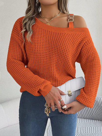 Person wearing an orange knitted sweater with a white background