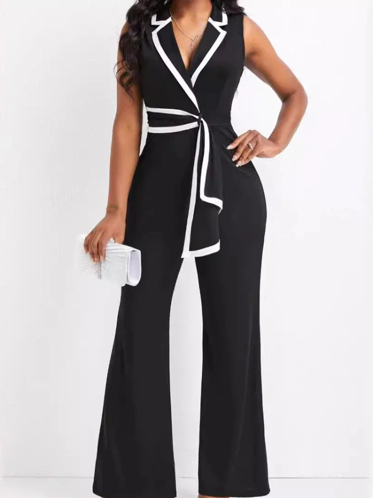 Black and white jumpsuit worn by a model on a white background