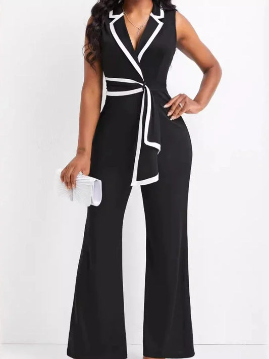 Black and white jumpsuit worn by a model on a white background