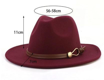 A burgundy felt wide-brim fedora hat with a brown band and gold-tone buckle, shown on a white background with dimension labels indicating 11cm height, 7cm brim width, and 56-58cm crown height.