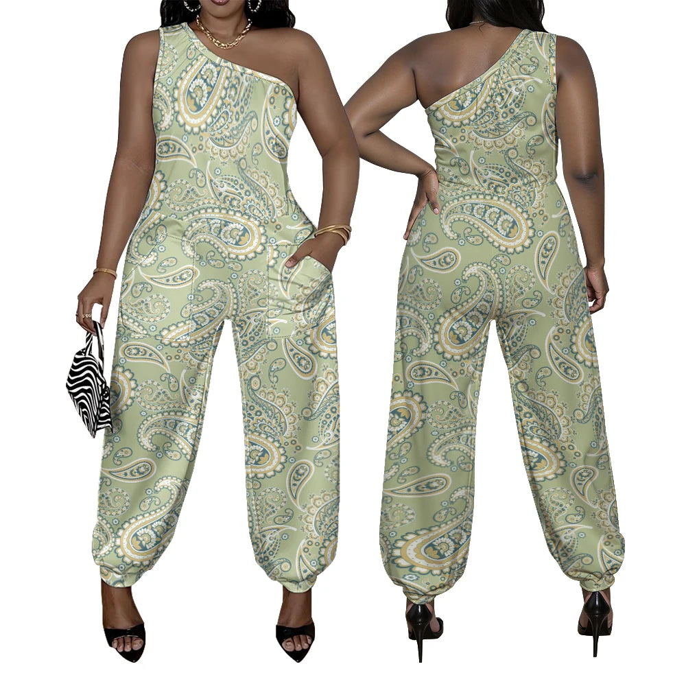 Green paisley patterned jumpsuit worn by a model on a white background