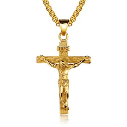Gold crucifix pendant on a white background
