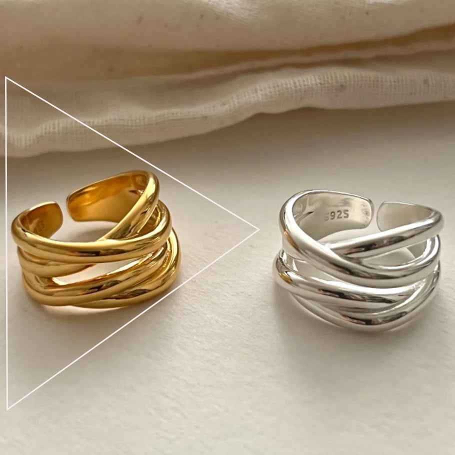 Gold and silver rings on a light background