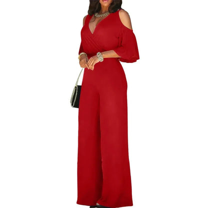 Red jumpsuit worn by a model on a white background
