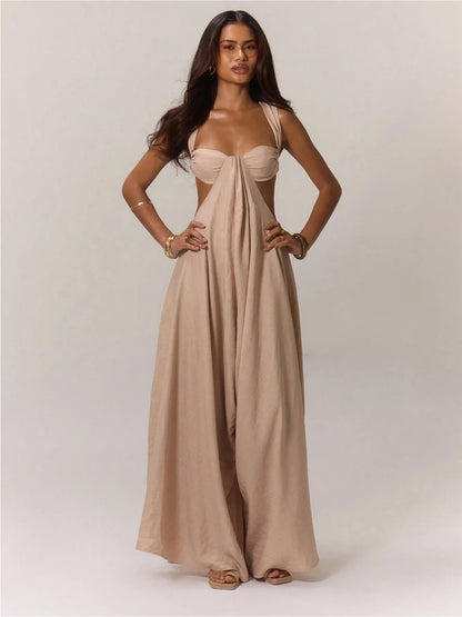 Woman wearing a beige evening gown on a plain background