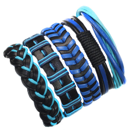 Set of black and blue braided bracelets on a white background