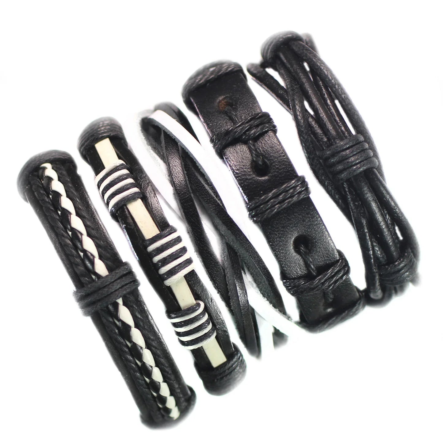 Set of black leather bracelets with various patterns on a white background