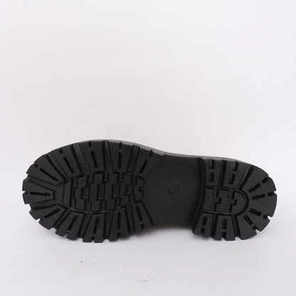 Black rubber sole of a shoe on a white background