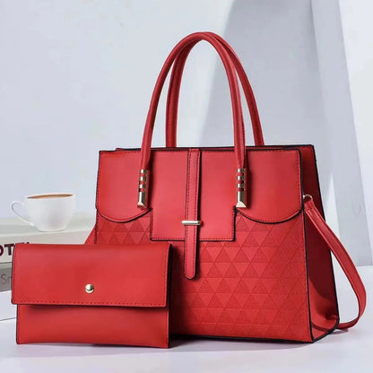 Red handbag with a matching wallet on a light gray background
