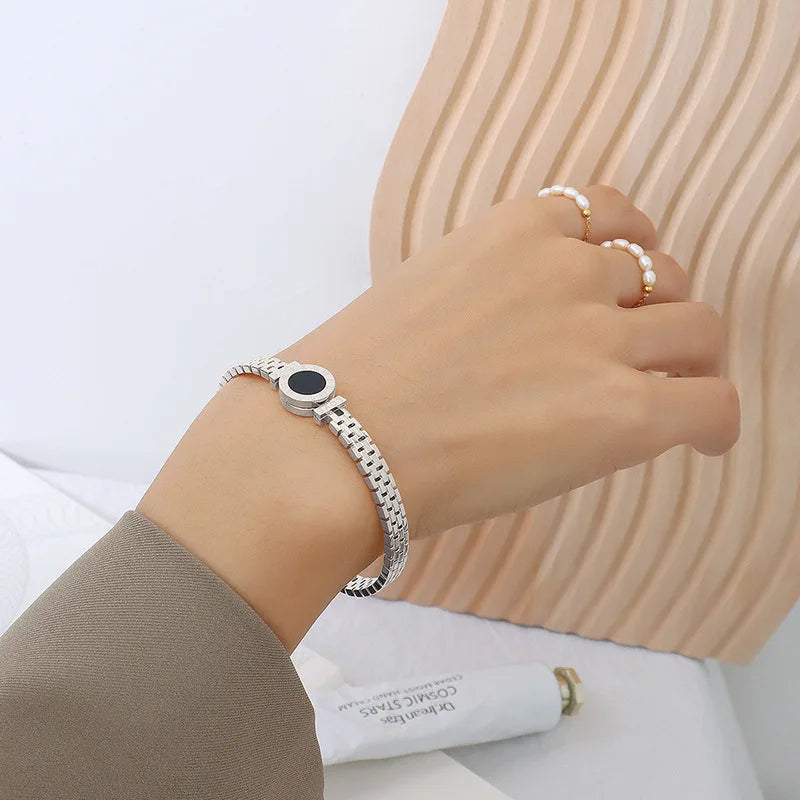 Silver bracelet with a black bead black stone