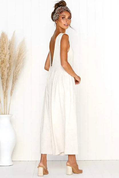 Modest white jumpsuit with a wide-leg fit.