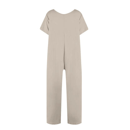 A light beige short-sleeve jumpsuit with a wide scoop neckline, photographed flat against a solid white background.