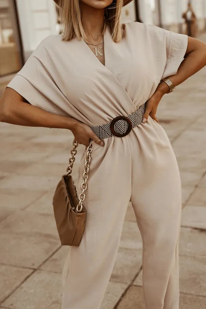 Beige wide leg jumpsuit paired with a hat